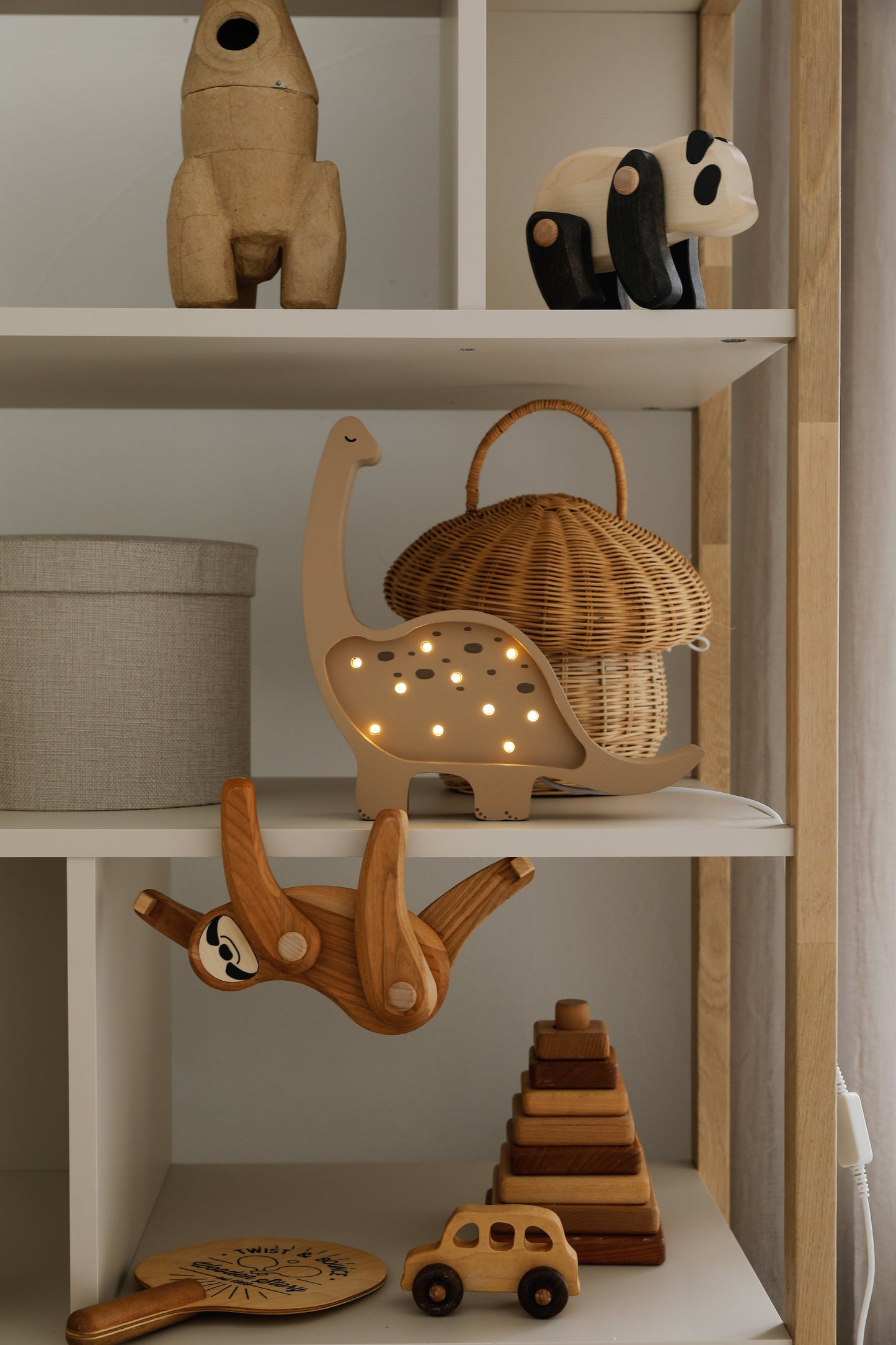 Wooden dino night light in warm coffee tone for kids’ bedrooms