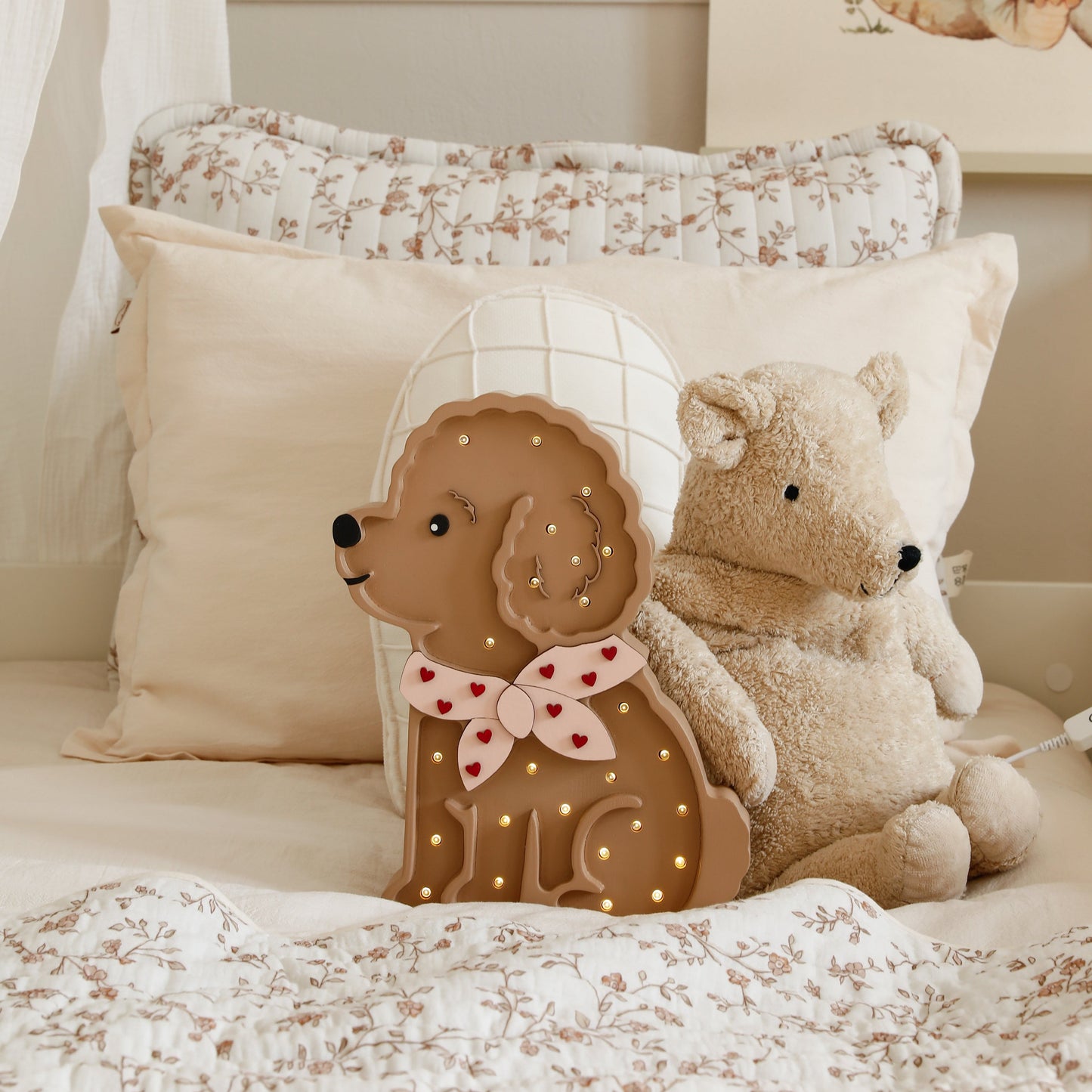 Cozy girls room with the Poodle Dog night light on the bed next to a teddy bear