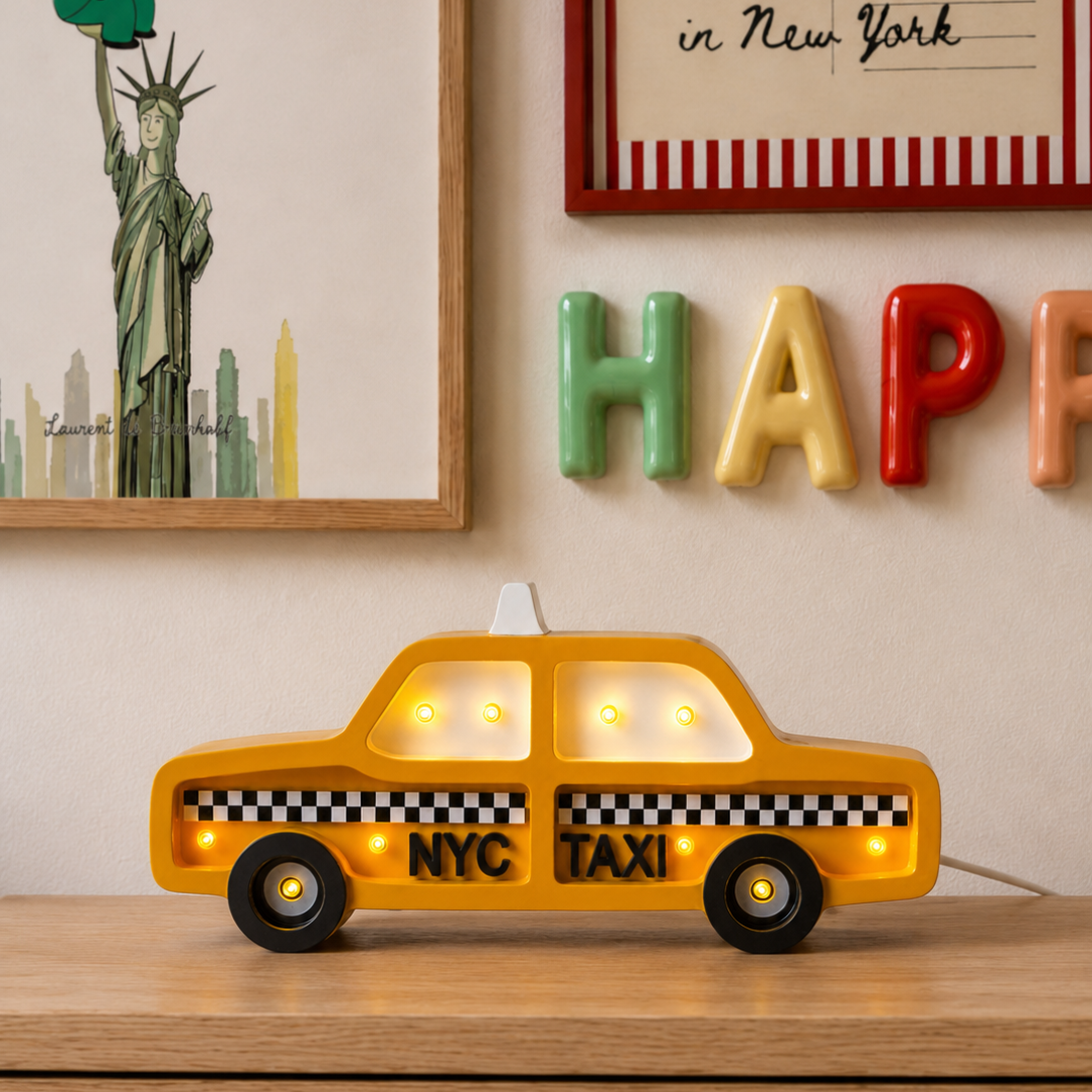 Yellow NYC Taxi Night Light on a wooden dresser in a kid's room